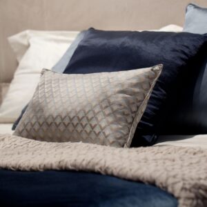 several soft pillows on the bed