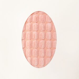 Design abstract easter minimal concept. Lovely pink textile with original design on it, egg shaped against of white background
